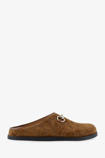 Gucci women’s brown suede slip-on mule with gg monogram pattern and metallic horsebit buckle detailing