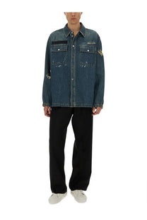 Helmut Lang men’s blue distressed denim uniform shirt with frayed patches and subtle embroidered chest logo