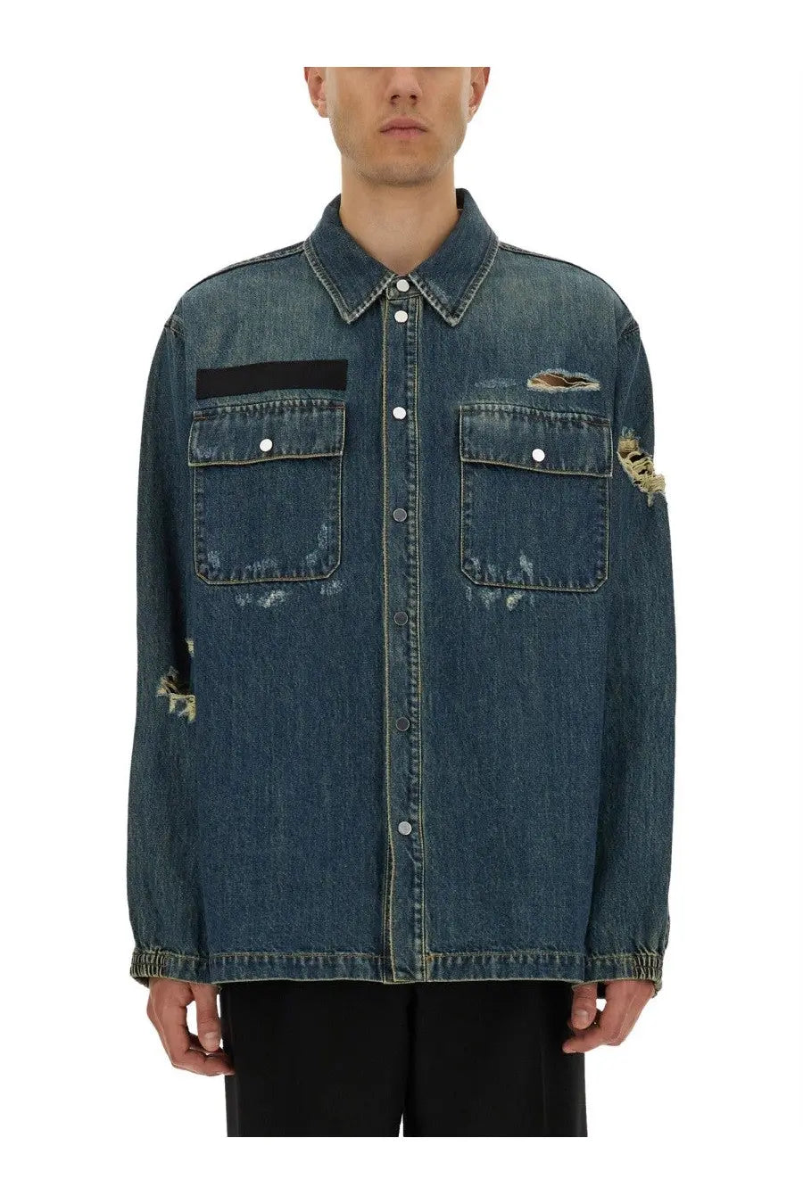 Helmut Lang men’s blue distressed denim uniform shirt with frayed patches and black rectangular chest patch