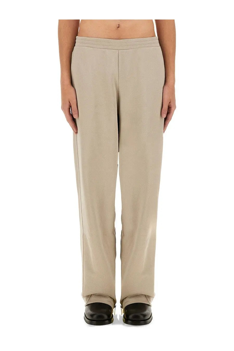 Helmut Lang men’s jogging pants grey with smooth lightweight fabric beige wide-leg trousers and subtle side seam detailing