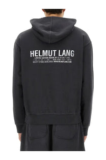 Dark gray helmut lang limited edition hoodie showing the back with bold white printed logo across the back