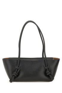 Hereu women’s fleca grainy bag black is a black leather tote with textured surface and knotted strap details