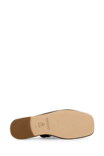 Hereu women’s llasada black leather flat shoe with square heel and beige insole viewed from the back side