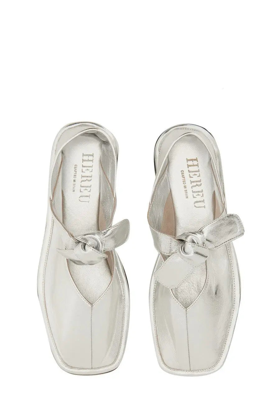 Hereu women’s llasada silver leather mules with bow detail in metallic finish for stylish casual wear