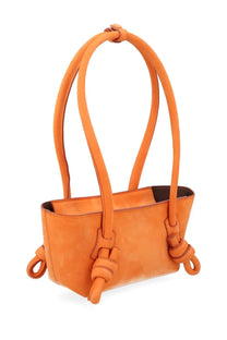 Hereu women’s mini fleca bag in orange suede with distinctive knotted leather handles and side ties
