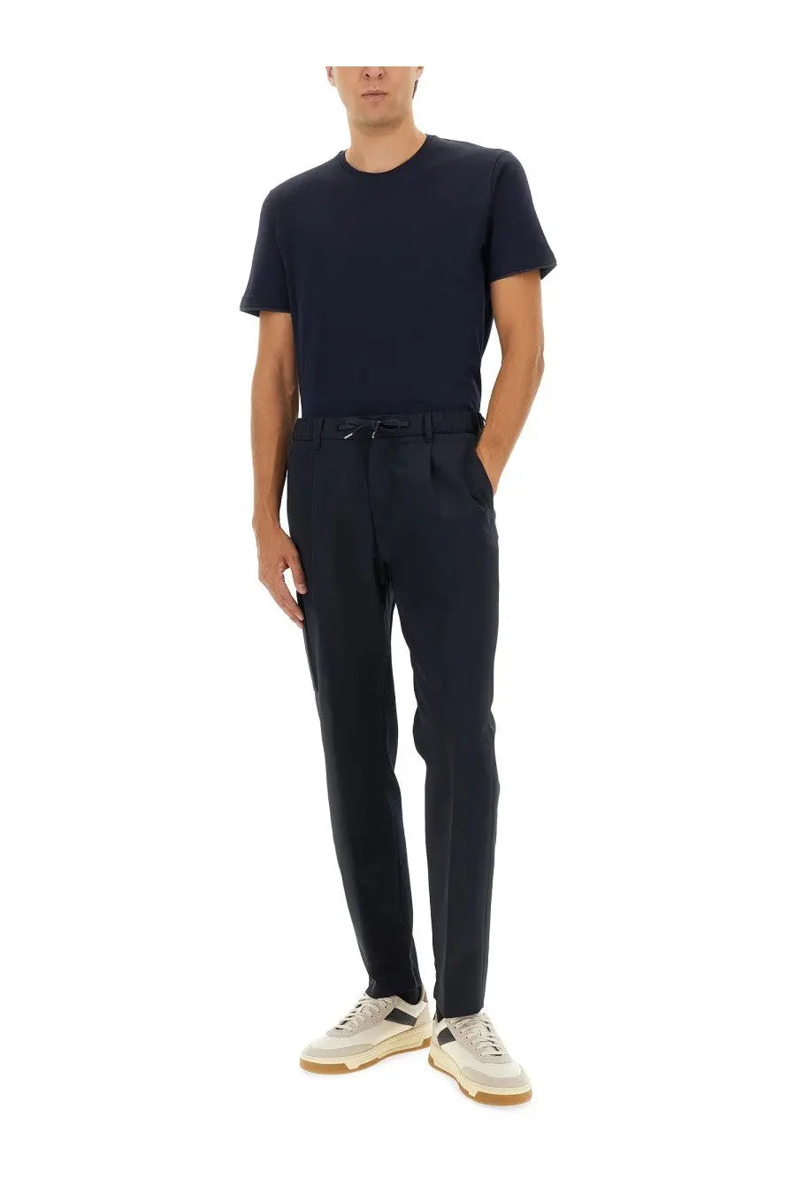 Navy blue tailored trousers with drawstring waistband and subtle front pleats from herno men’s cotton collection