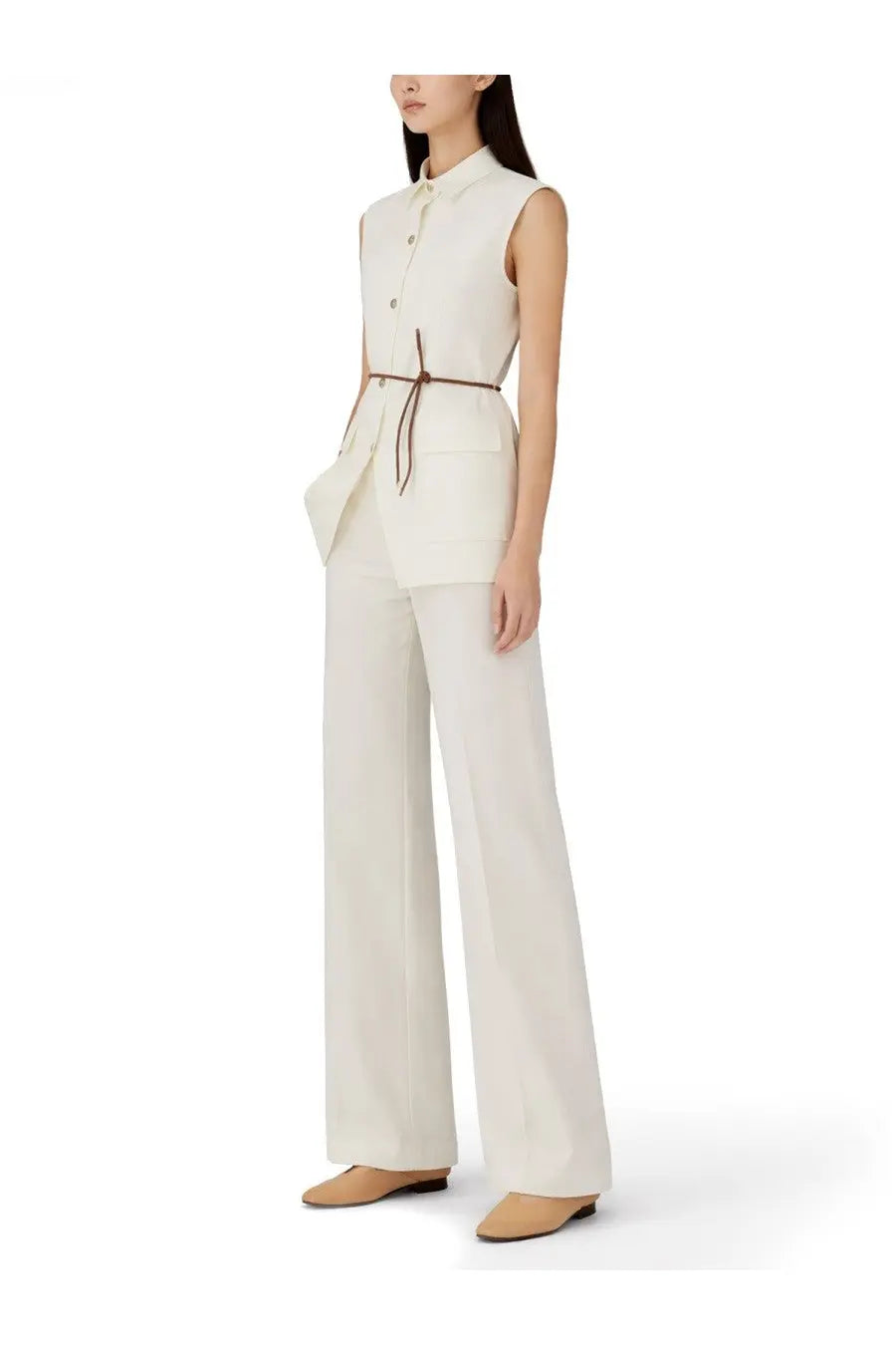 Herno women’s cream sleeveless button-up top with matching high-waisted wide-leg pants and brown leather belt