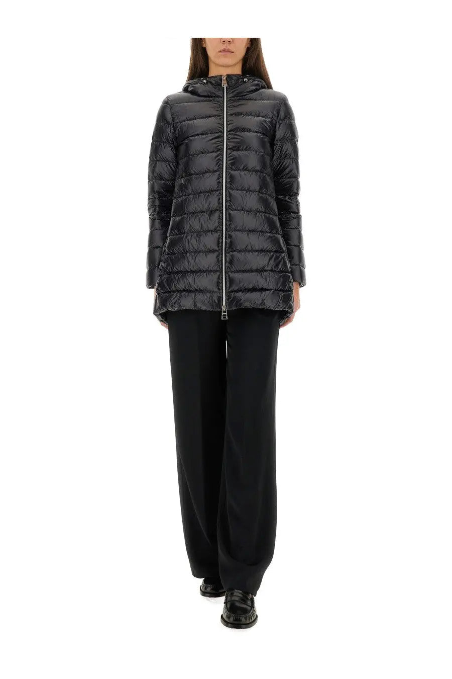 Black quilted hooded puffer jacket with silver zipper featured in herno women’s pants resort black collection