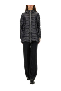 Black quilted hooded puffer jacket with silver zipper featured in herno women’s pants resort black collection