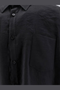 Hevò men’s Arpinova modal blend black button-up shirt with subtle texture and matching dark buttons