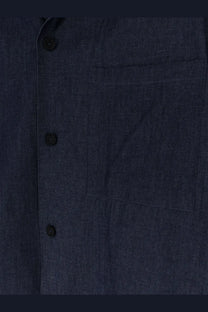 Hevò men’s blue denim shirt with dark blue fabric black buttons and a single chest pocket