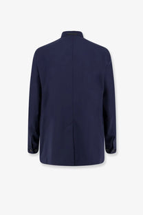 Navy blue tailored blazer with sleek modern cut and subtle seam detailing made from wool blend by hevò men