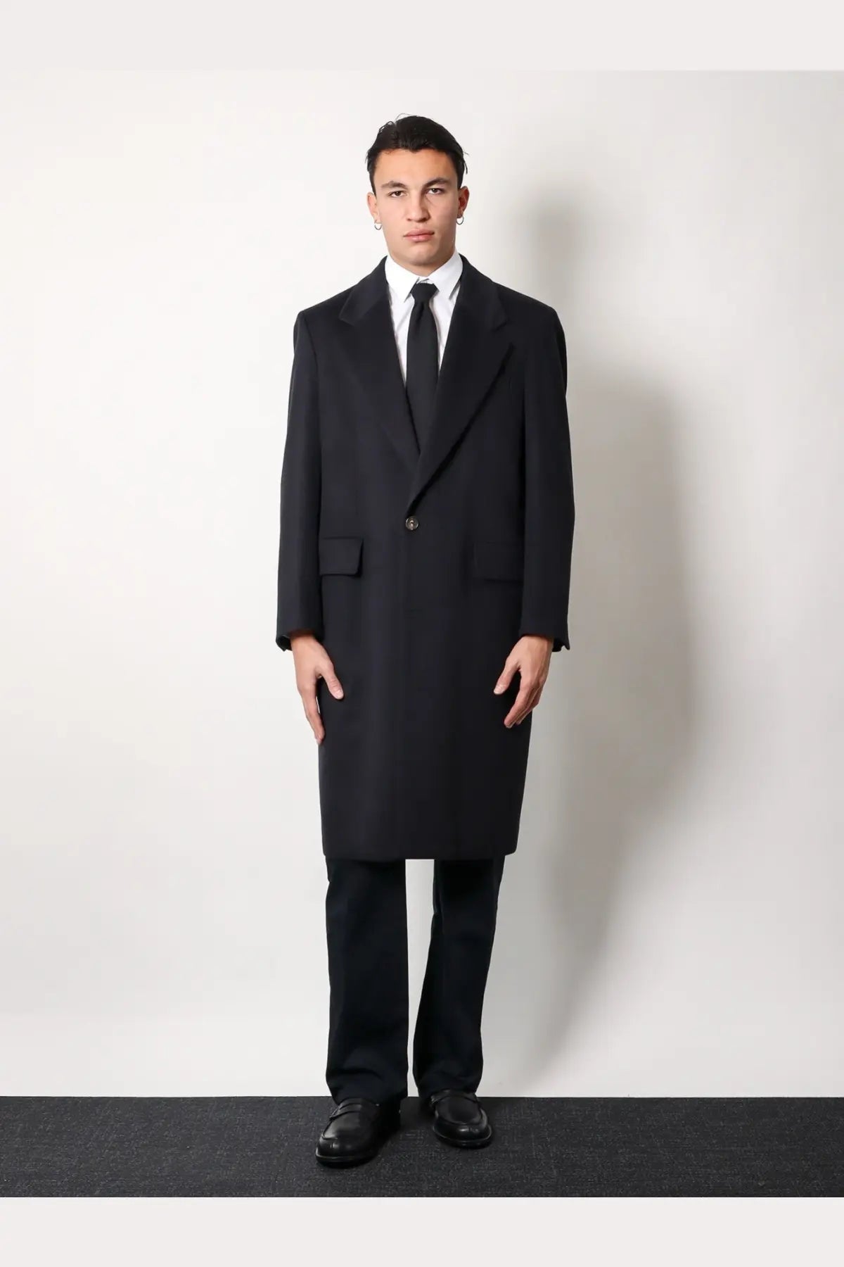 Black wool overcoat with notched lapels and two front flap pockets from hevò mens cashmere coat blue collection