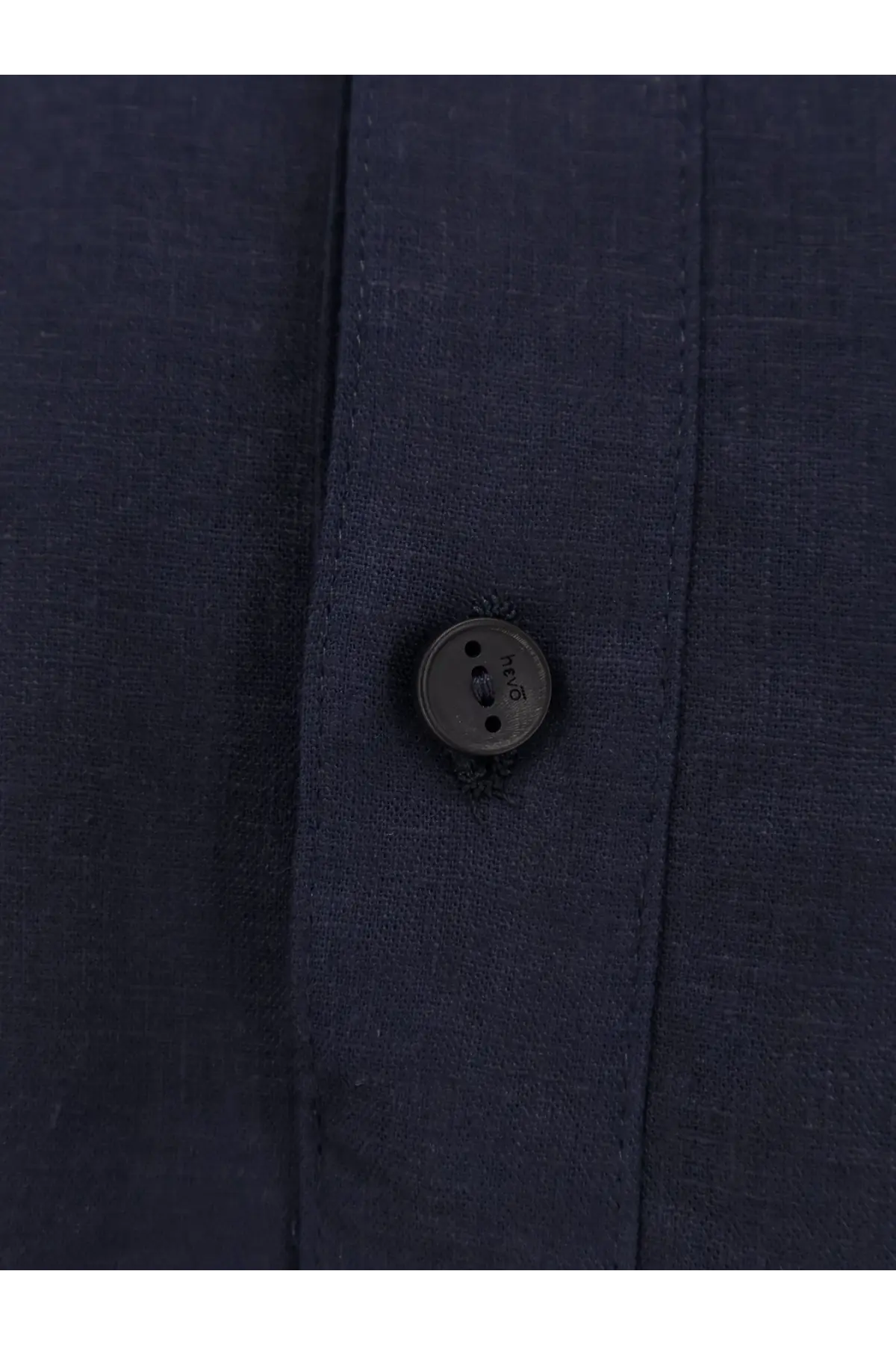 Dark gray textured button on navy blue fabric of hevò mens montursi linen and viscose shirt blue