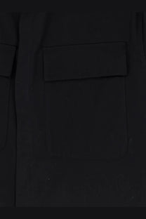 Close-up of black cotton pocket with flap closure on hevò mens specchiolla shirt