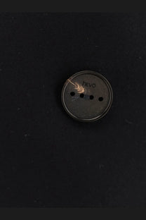 Dark gray circular hevo button with four holes on the hevò men’s trani double breasted blue wool blend coat