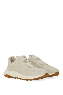 Cream-colored suede hogan men’s hyperlight sneaker with contrasting tan rubber sole and white midsole