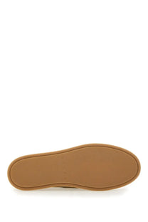 Tan rubber sole with hogan embossed on the back of hogan men’s leather boat moccasin beige