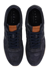 Navy blue suede Hogan men’s sneaker with orange leather accents athletic blue design