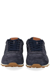 Hogan men’s sneaker athletic blue navy blue suede with tan rubber soles and matching laces in front view