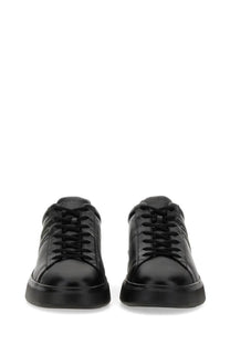 Hogan men’s sneaker H580 black low-top leather sneaker with a sleek glossy finish and subtle stitched detailing