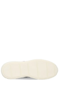 Cream-colored rubber sole with chunky block design on hogan men’s blue suede sneaker side view