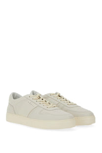 Cream-colored leather men’s hogan tv sneakers with minimalist design and matching laces in white