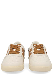 Cream-colored leather hogan women’s sneaker beige with tan laces and matching side stripes for casual wear