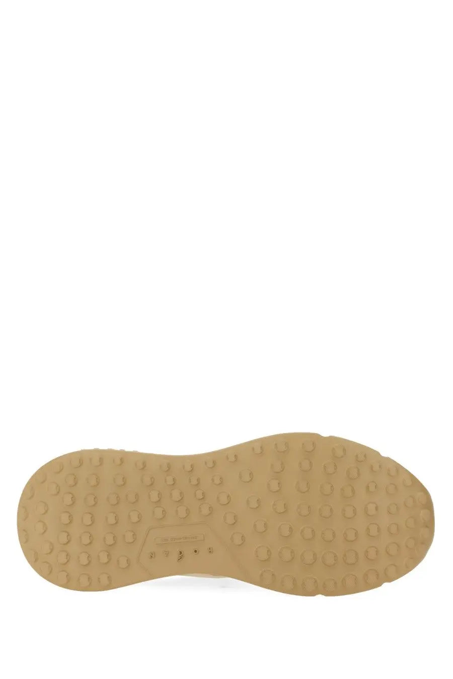 Tan rubber sole with textured circular tread pattern of hogan women leather sneaker beige back side view