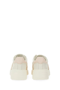 Cream-colored hogan women’s rebel platform sneakers with soft blush pink heel tab and subtle vertical stitching details