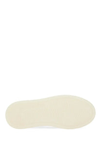 Cream-colored rubber sole with smooth slightly textured surface on the back of hogan women’s sneaker h630 red