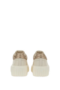 Hogan women’s sneaker stripes beige with cream-colored leather, metallic gold accents, and chunky white rubber sole