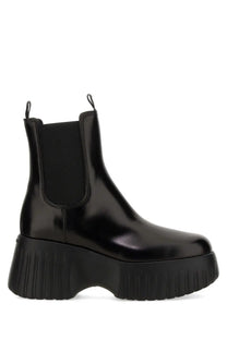 Hogan women’s stripe chelsea boot black in black patent leather with a chunky ribbed platform sole