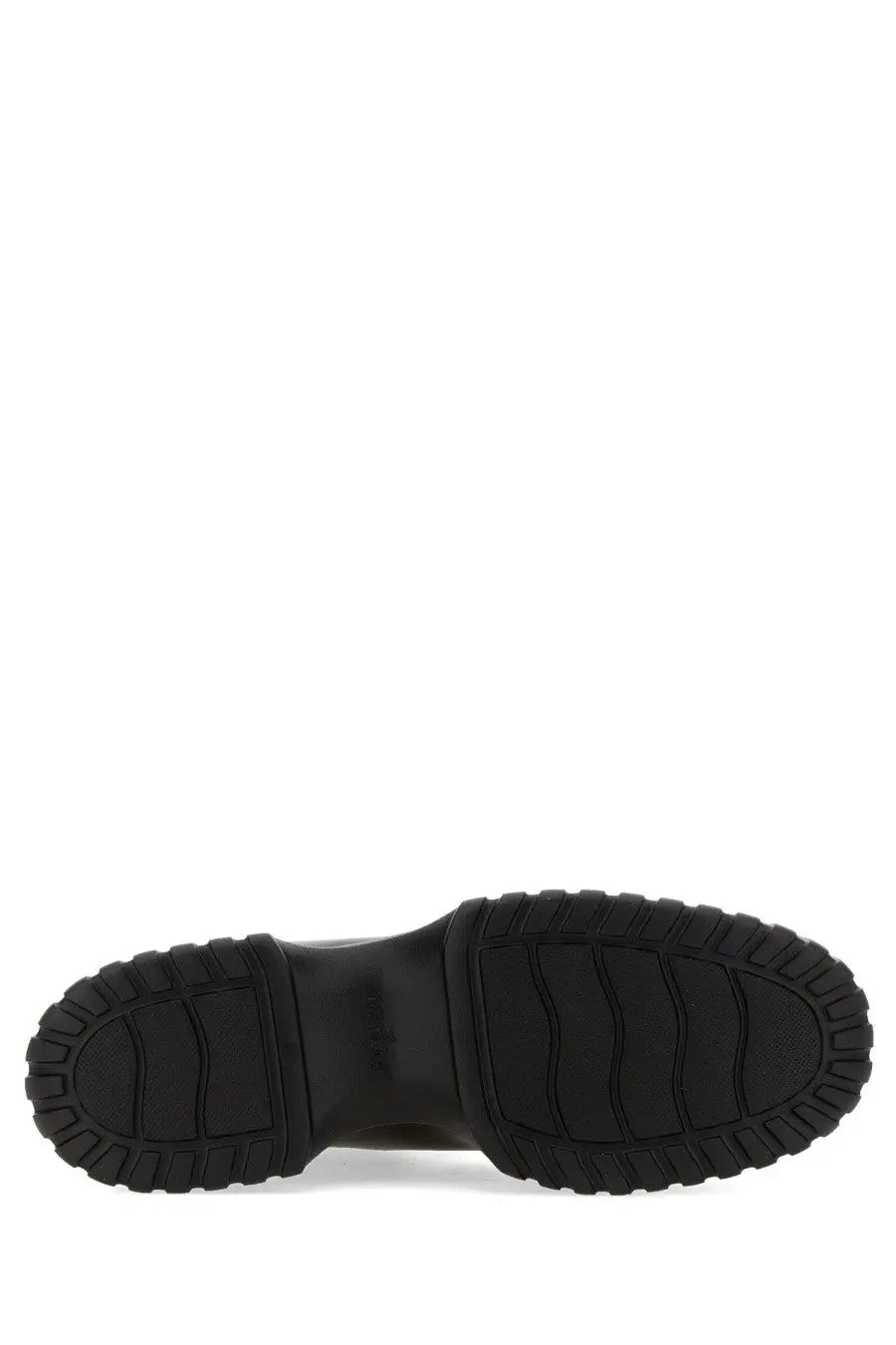 Black rubber sole with chunky textured tread on the back of hogan women’s stripe chelsea boot black