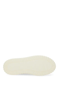 Cream-colored rubber sole with textured raised edge on the back of hogan women’s stripe sneaker white