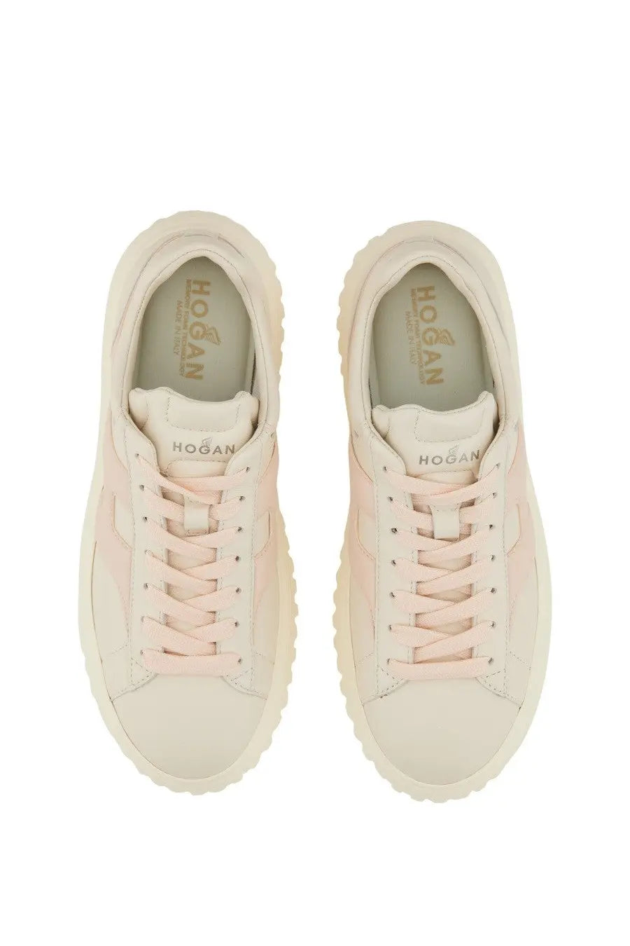Cream-colored Hogan women’s stripe sneaker with soft pink suede overlay and chunky rubber sole