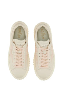 Cream-colored Hogan women’s stripe sneaker with soft pink suede overlay and chunky rubber sole