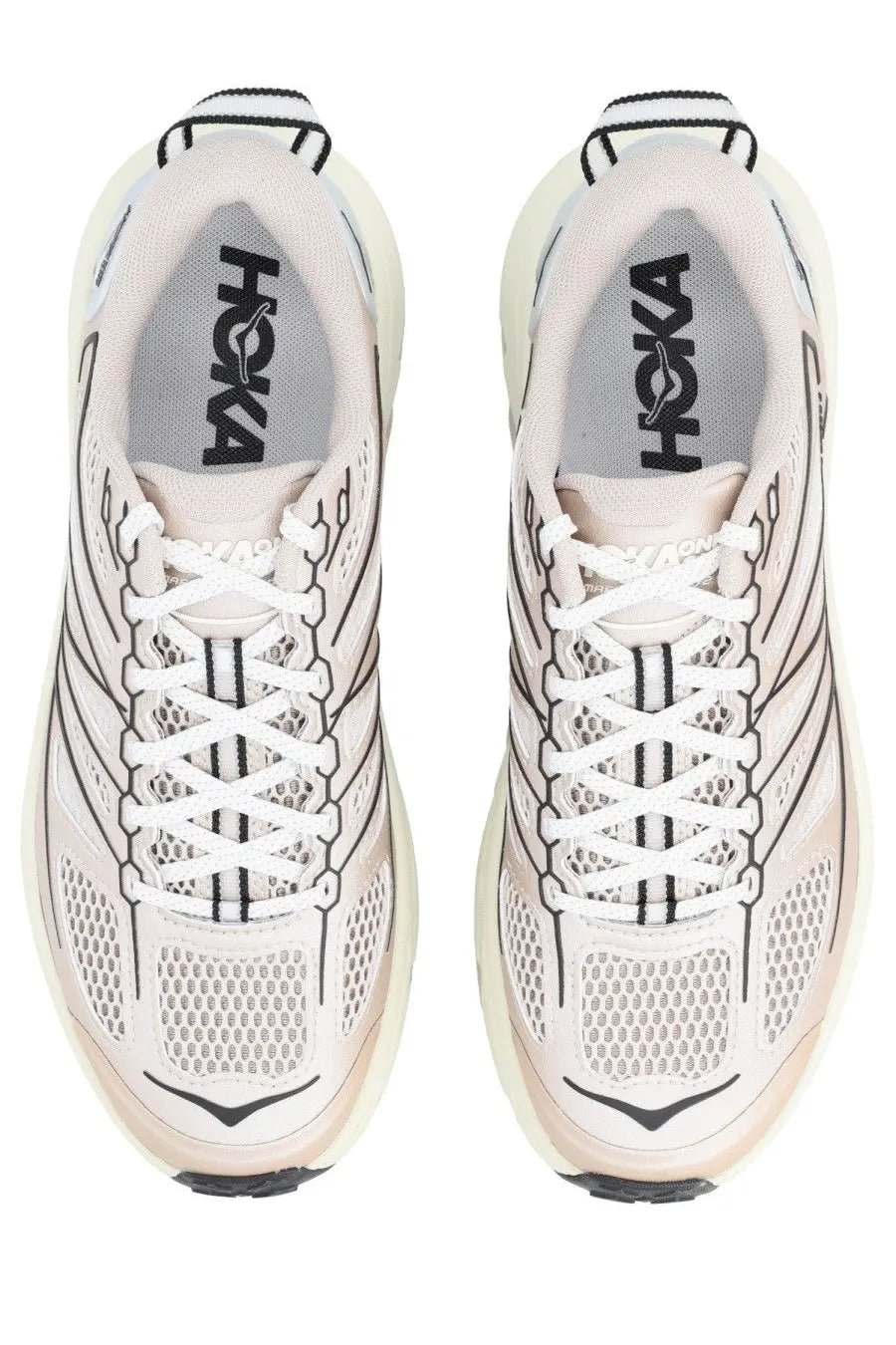 Pair of hoka one one mafate beige unisex running shoes with breathable mesh uppers and bold geometric detailing