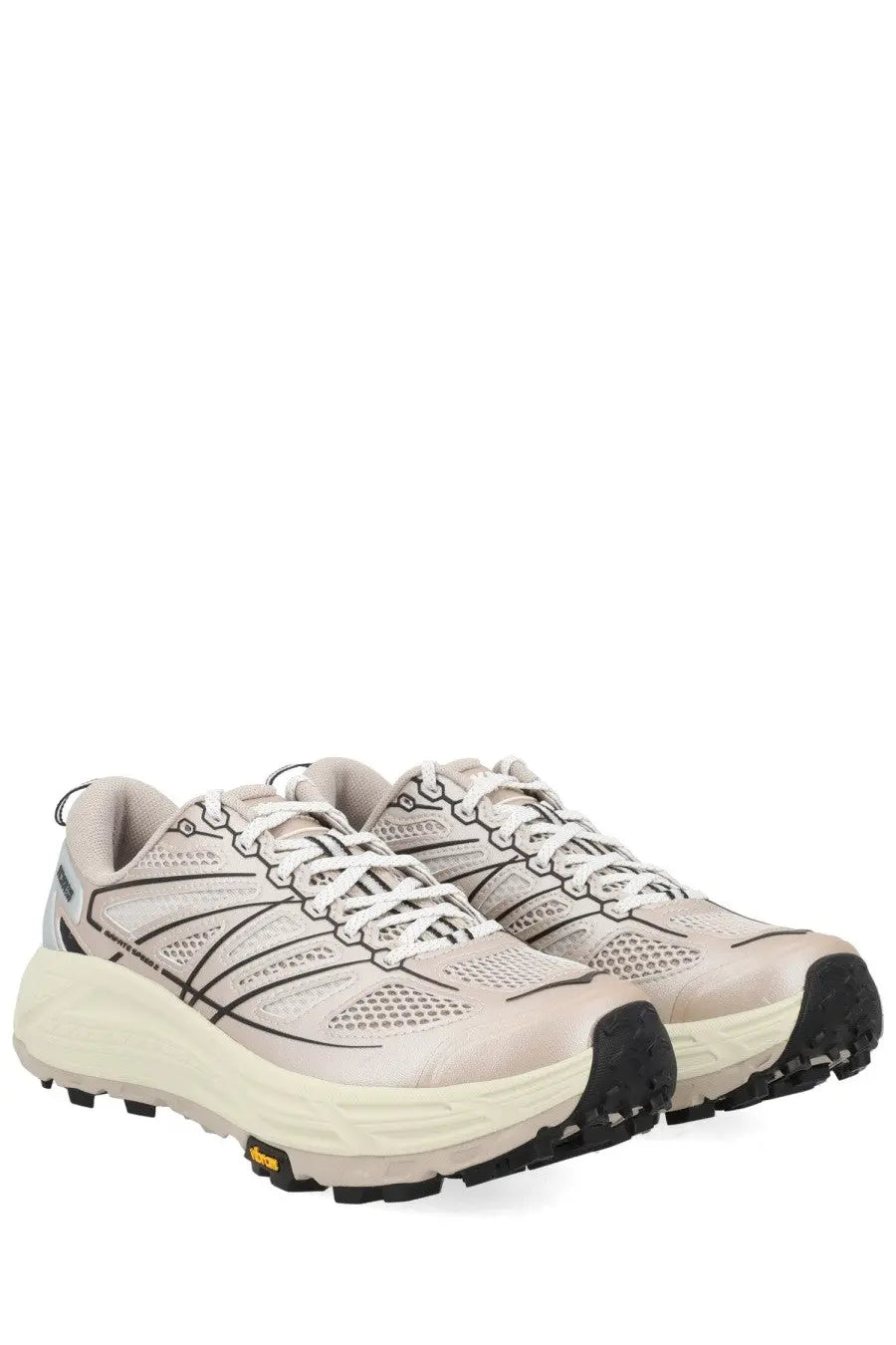 Beige hoka unisex sneaker mafate running shoes with black accents and durable vibram outsole for trail use