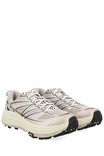 Beige hoka unisex sneaker mafate running shoes with black accents and durable vibram outsole for trail use