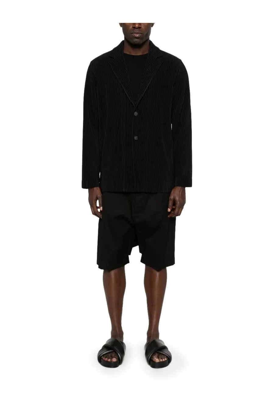 Black pleated Homme Plisse Issey Miyake men’s blazer with structured collar and three buttons in sleek design