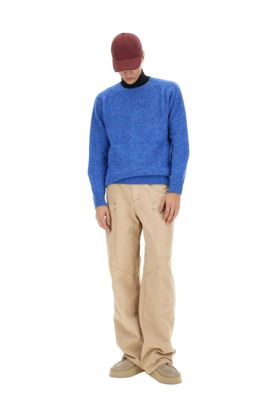 Howlin men’s wool jersey blue textured knit sweater with ribbed cuffs and hem shown from the back