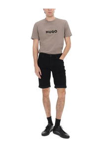 Beige hugo t-shirt with black logo printed across the chest paired with hugo boss men’s black shorts con patch