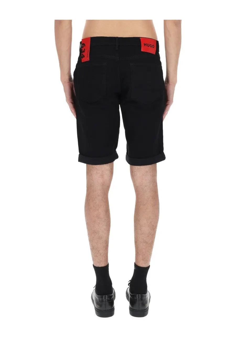Black hugo boss men’s shorts with red branded patches on waistband in durable fabric for casual wear