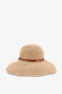 Beige straw sun hat with wide brim and brown leather band by Ibeliv women’s rova raffia hat tea model