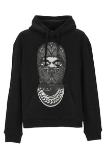 Ih nom uh nit men’s black hoodie featuring a bold face graphic with paisley bandana and layered chain necklaces print
