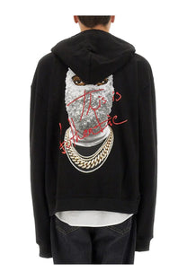 Ih nom uh nit men’s black hoodie with glittery silver face graphic red cursive text and gold chain details
