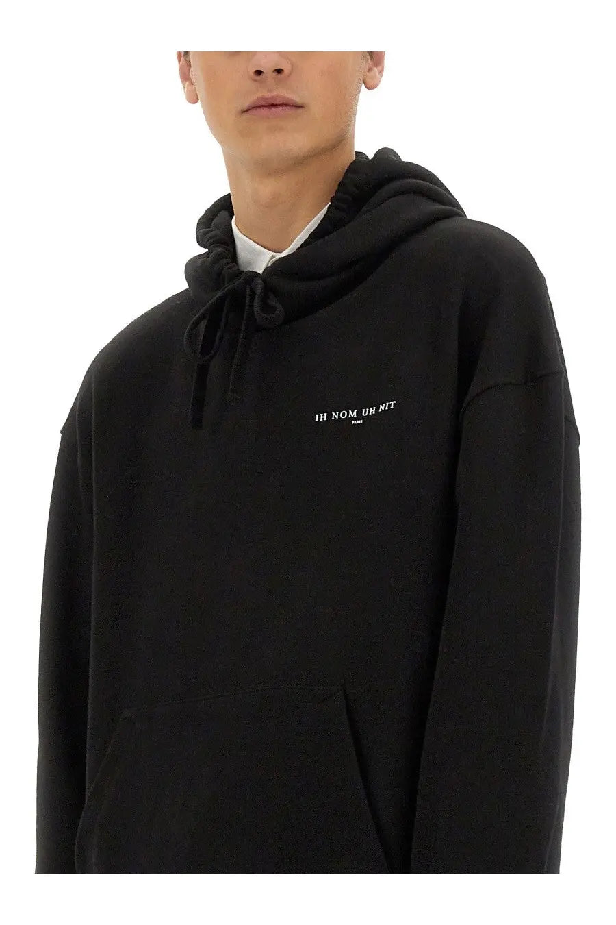 Ih nom uh nit men’s black oversized hoodie with drawstring hood and white embroidered text on chest