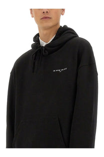 Ih nom uh nit men’s black oversized hoodie with drawstring hood and white embroidered text on chest