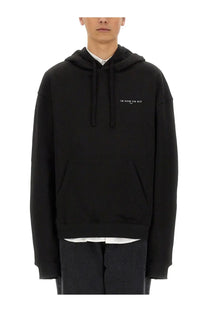 Ih nom uh nit men’s black oversized hoodie with subtle white embroidered logo on chest in cotton blend
